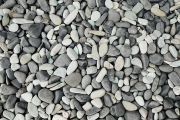 Close-Up Background of Black, Gray, and White Pebbles (Lapides) in Natural Arrangement