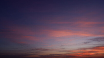 A stunning sunrise with the sky transitioning from deep purple to lighter shades of pink and...