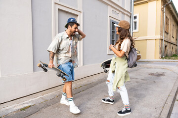 Couple goals. Simple living. Freedom as lifestyle. Young couple enjoying outdoor and sunset. Having fun on nice weather. Man and woman, hipsters, generation Z with cool attitude.