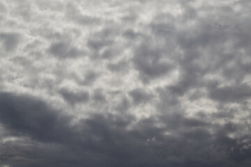 Gray clouds in the sky blurred background, blurry clouds in the gray sky, close-up of gray clouds covering the sky, blur