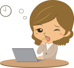 パソコンの前で眠そうな女性