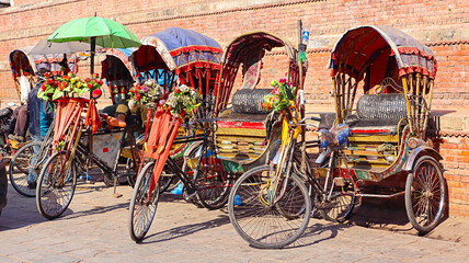 NEPAL, KATHMANDU, December 2023, People at Cycle Rikshaw Parking in Line, Kathmandu Durbar Square