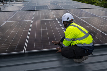 Expertise black solar engineer man working with solar panel installation on roof