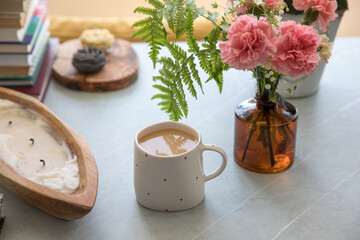 Coffee in a cup in a heart on the table