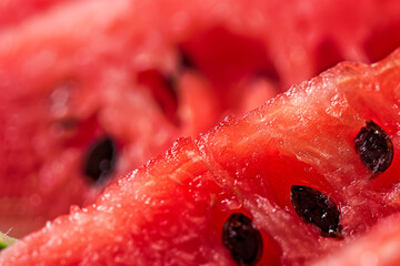 Watermelon texture background with seeds close up macro shot.