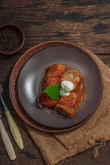 Cabbage rolls stuffed with rice and meat stewed in tomato sauce. Traditional dish, ready-to-eat food