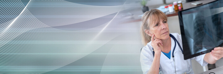 Female doctor looking at x-ray; panoramic banner