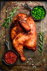 Grilled chicken on a metal tray. Barbecue. Traditional festive dish. © Yaruniv-Studio