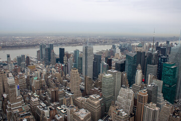 Fototapeta premium Aerial view of Manhattan in New York City showing the classic high rise buildings and city scape in the USA