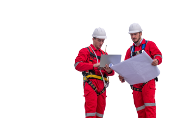 Engineer factory electrical using a notebook computer and blueprint standing at a power station planning work producing electrical energy with white background.