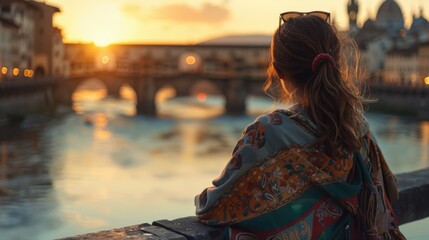 A woman sitting on a bridge overlooking a river. Suitable for travel and relaxation concepts