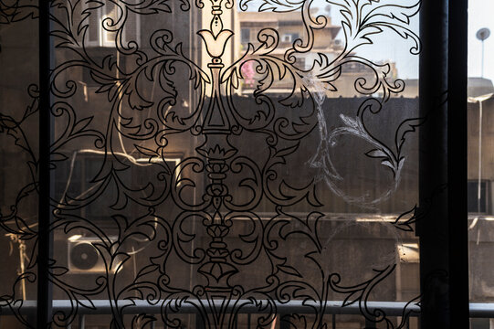 View of Urban Building through Decorative Grille