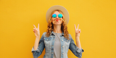 Portrait stylish funny young woman showing mustache her hair blowing lips wearing summer straw hat