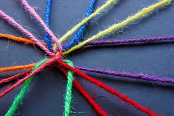 Connected colored threads as a concept for contacts, communication or teamwork, brainstorming.