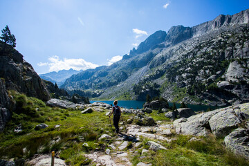 Fototapeta premium Young hiker woman in Vall de Boi, Aiguestortes and Sant Maurici National Park, Spain
