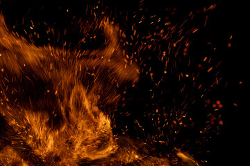 fire flame with sparks on black background.