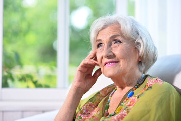 Portrait of a beautiful woman in the park in summer