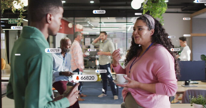 Image of social media data processing over diverse business people in office