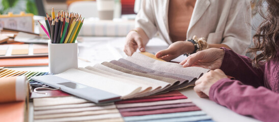 Interior designers checking fabric swatches