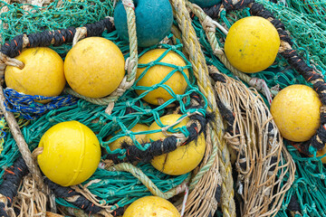 yellow net balls and fishing nets in various colors