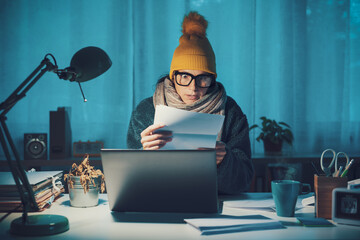 Woman checking expensive utility bills