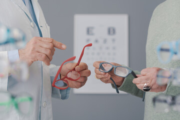 Patient having an eye test and choosing glasses