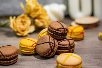 Colorful macarons and delicate roses arranged on a table