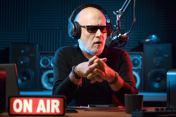 Radio presenter talking into the microphone