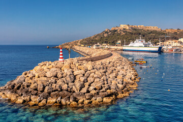 Maltese Coastline Cruise, Passengers enjoy breathtaking views on Gozo Fast Ferry in Mgarr harbor returning to Malta from the sister island. Malta travel destination.