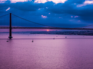 25th April Bridge over the Tejo River at sunset in Lisbon, Portugal