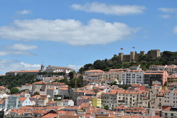 Aerial view of buildings and landmarks in Lisbon Portugal with incredible architecture and a blue sky background. 