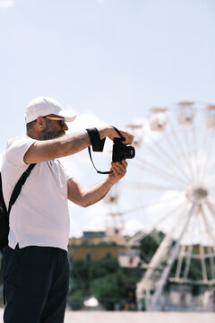 Tirana, Albania - 25 May 2024: photographer shooting at Skanderbeg square.