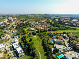 Aerial view of a golf court in the middle of a condominium in Beloura, Sintra, Portugal
