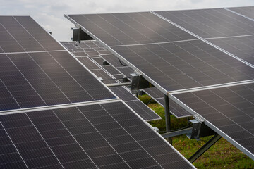 Rows array of photovoltaics solar cells in solar power station. Alternative clean renewable energy...