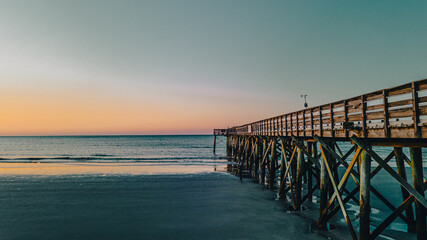 Fototapeta premium Beautiful view of a sunrise over Isle of Palms beach in Charleston