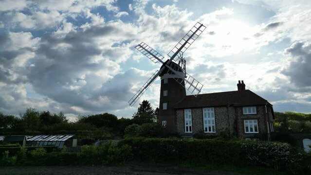 Drone shot if a windmill in Weybourne during a sunny day.