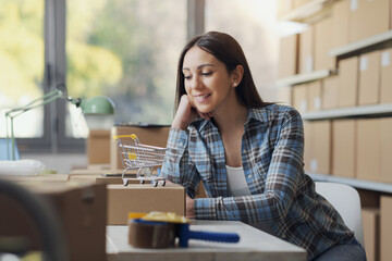 E-commerce business owner posing in her store