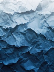 Fototapeta premium A blue and white paper with a wave pattern. The paper is crumpled and torn, giving it a rough and textured appearance. The blue and white colors create a calming and serene mood