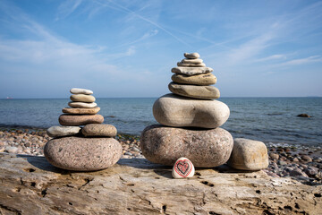 Scenic view of rock towers built on the beach against the sea