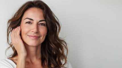 Portrait of a Smiling Mature Brunette with Copy Space, Woman in Her 40s or 50s, Middle Age Beauty and Confidence in Middle Age, Skincare, Lifestyle and Natural Cosmetics  Concept.