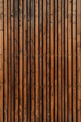 A wooden background with a lot of grain and texture. The wood grain is visible in the background and the wood is brown