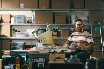 Happy vintage style nerd guy having a coffee break