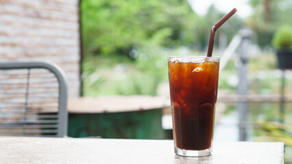 Ice americano coffee in a tall glass with ice cubes, Americano coffee or iced coffee without milk...
