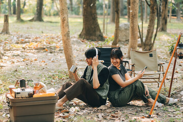 Asian couple sweet in tent inside on they camping trip, traveller relax and sleep togather in out...