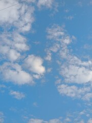 view of white clouds in a clear blue sky