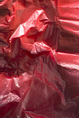 Plastic red background. Top view.