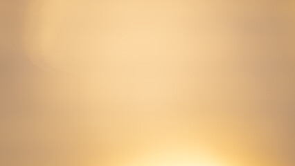 Golden bokeh background with soft, shimmering lights creating a warm ambiance.