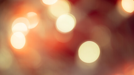 Fototapeta premium Golden and red bokeh lights create a soft, dreamy background