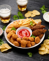 Chicken nuggets, Southern strips, Chicken fingers, french fries, chips, various sauces and beer