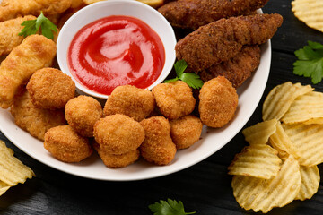 Chicken nuggets, Southern strips, Chicken fingers, french fries, chips, various sauces and beer